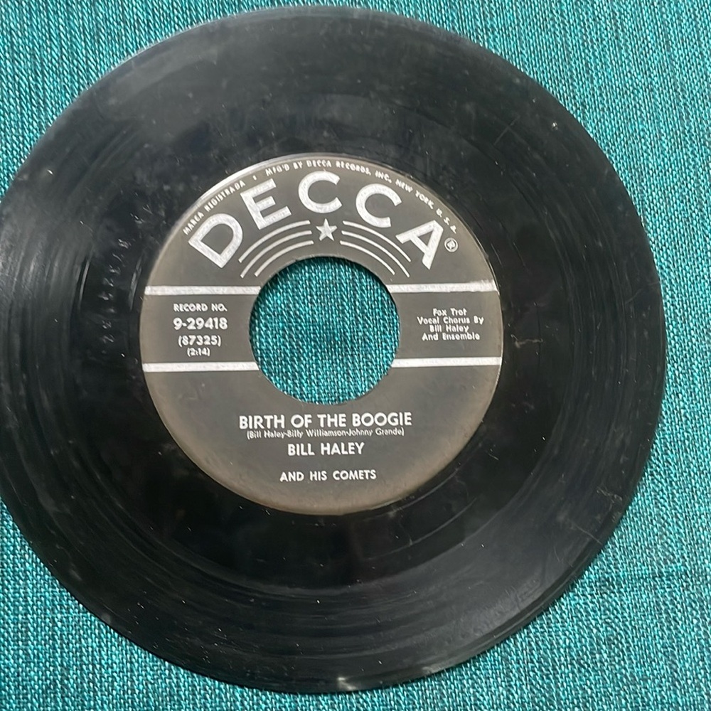 Bill Haley and His Comets.  “Birth of the Boogie” & “Mambo Rock”